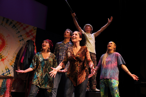 Rebecca Shoichet, Steve Maddock, Danielle St. Pierre, Bing Jensen, and Emily Rowed as Yippies levtitating the "Cop Shop"